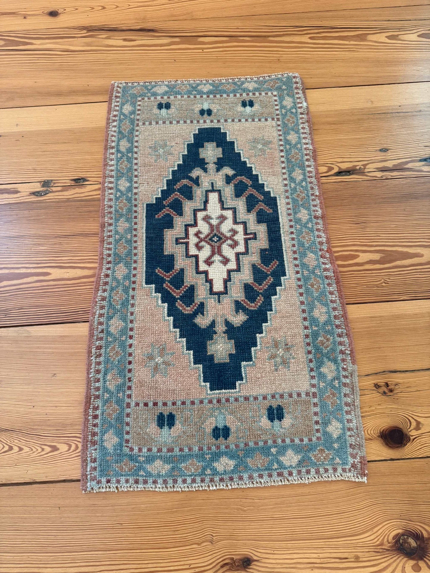 Small Turkish rug 1'8" x 3'1" with navy, beige, blue center medallion design, hand-knotted wool vintage Oushak style