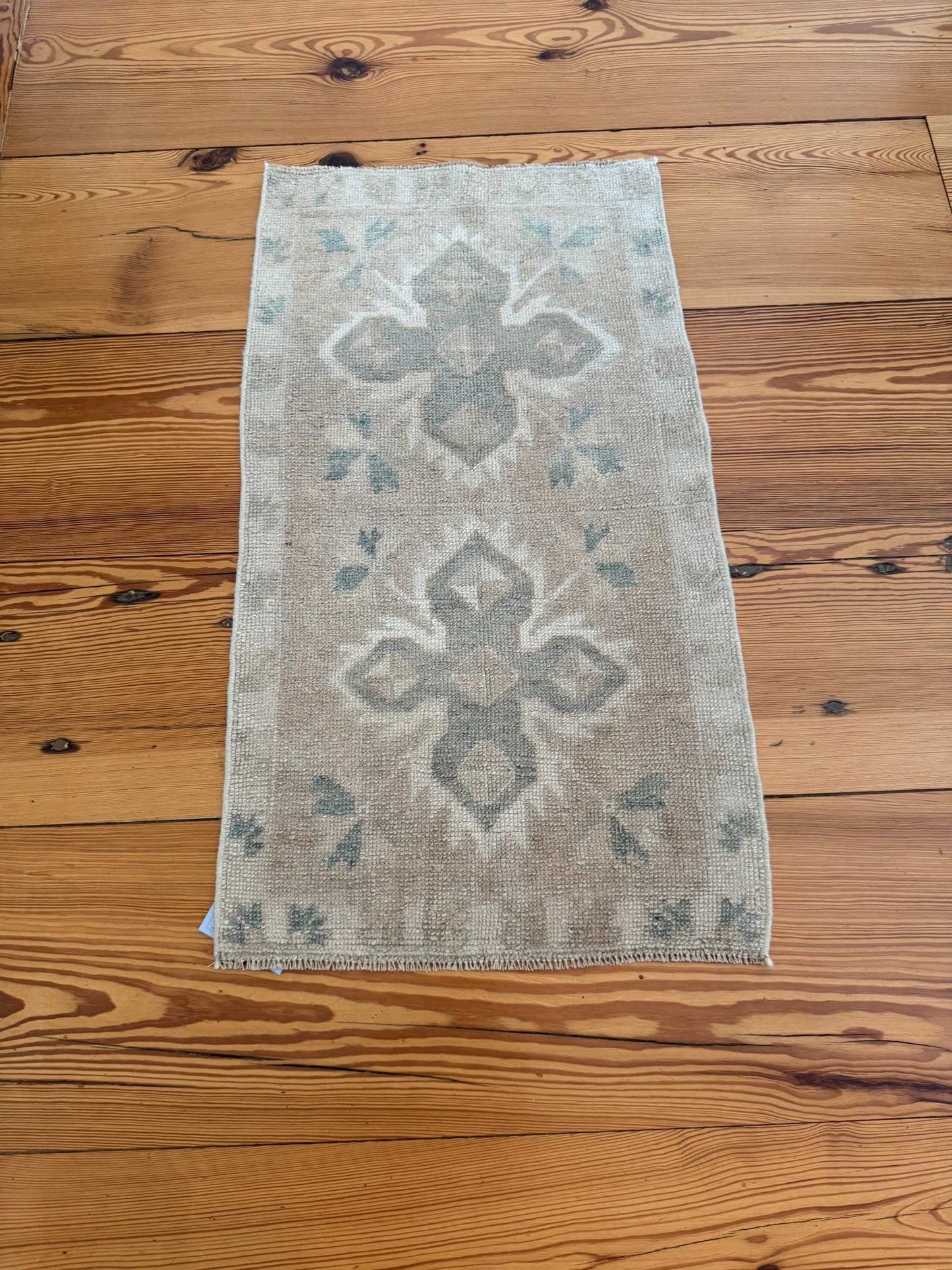 Small Oushak Rug with beige, tan, and pale sage green double cross design, hand-knotted wool vintage style
