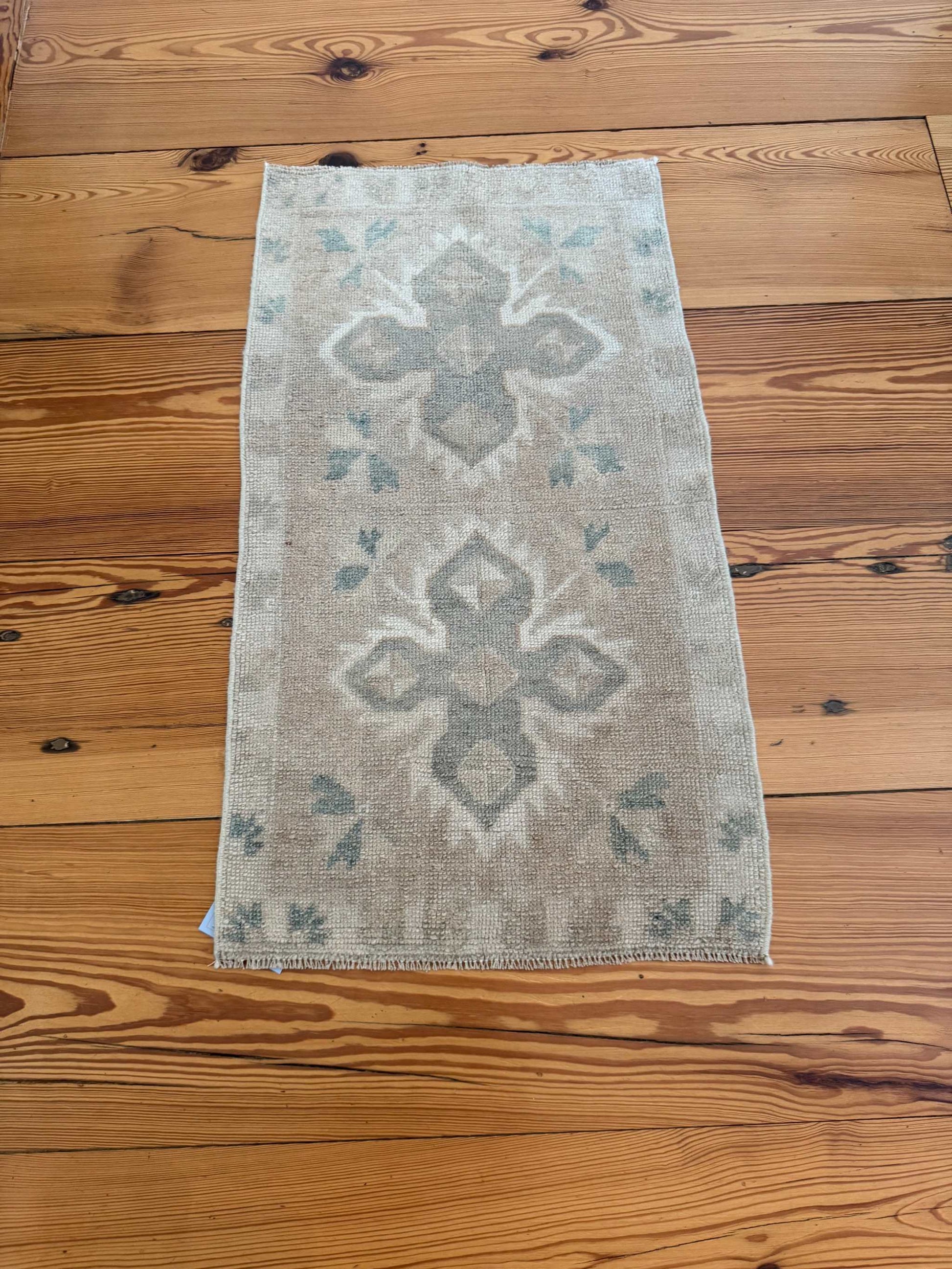 Small Oushak Rug with beige, tan, and pale sage green double cross design, hand-knotted wool vintage style