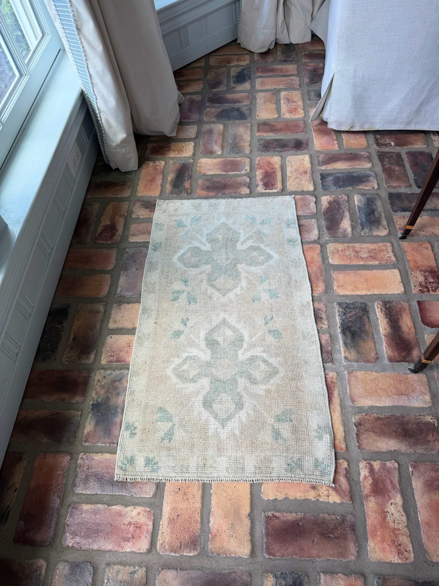 Small Oushak Rug in beige, tan, and pale sage green with double cross design, hand-knotted wool vintage style