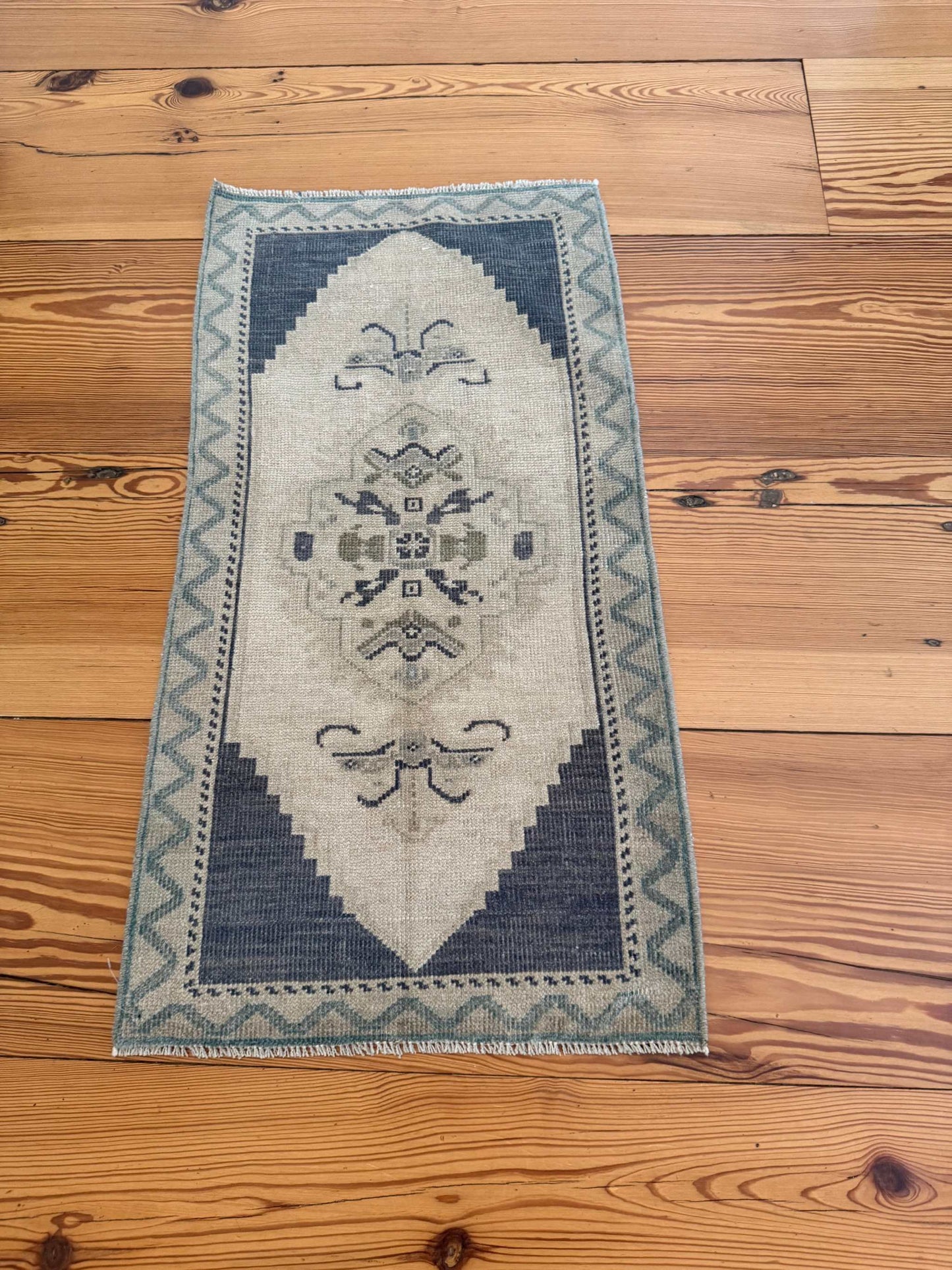 Small rug with slate blue and beige vintage hand-knotted wool design