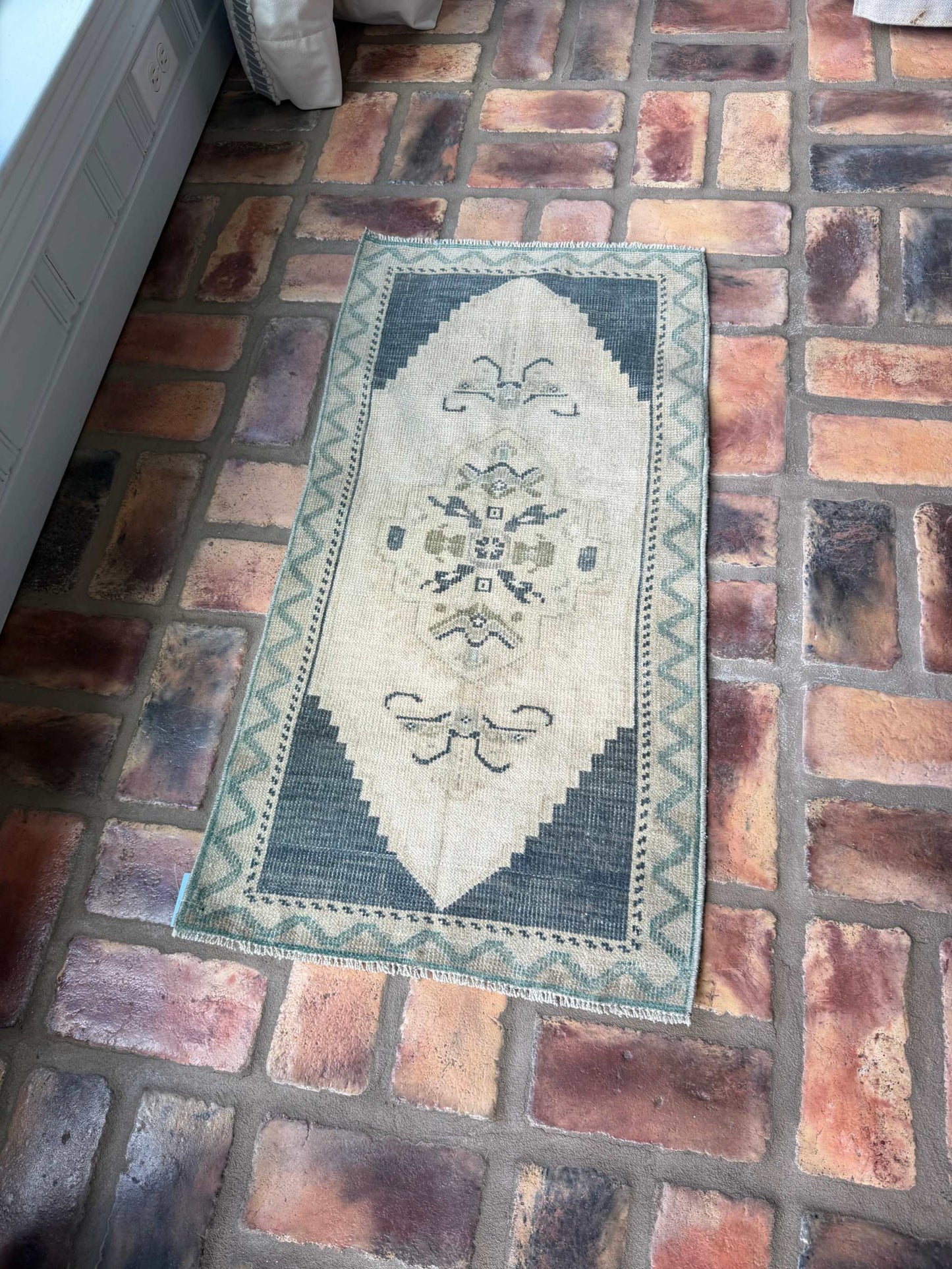 Small vintage hand-knotted wool rug in deep slate blue and beige, 1'6.5" x 3'