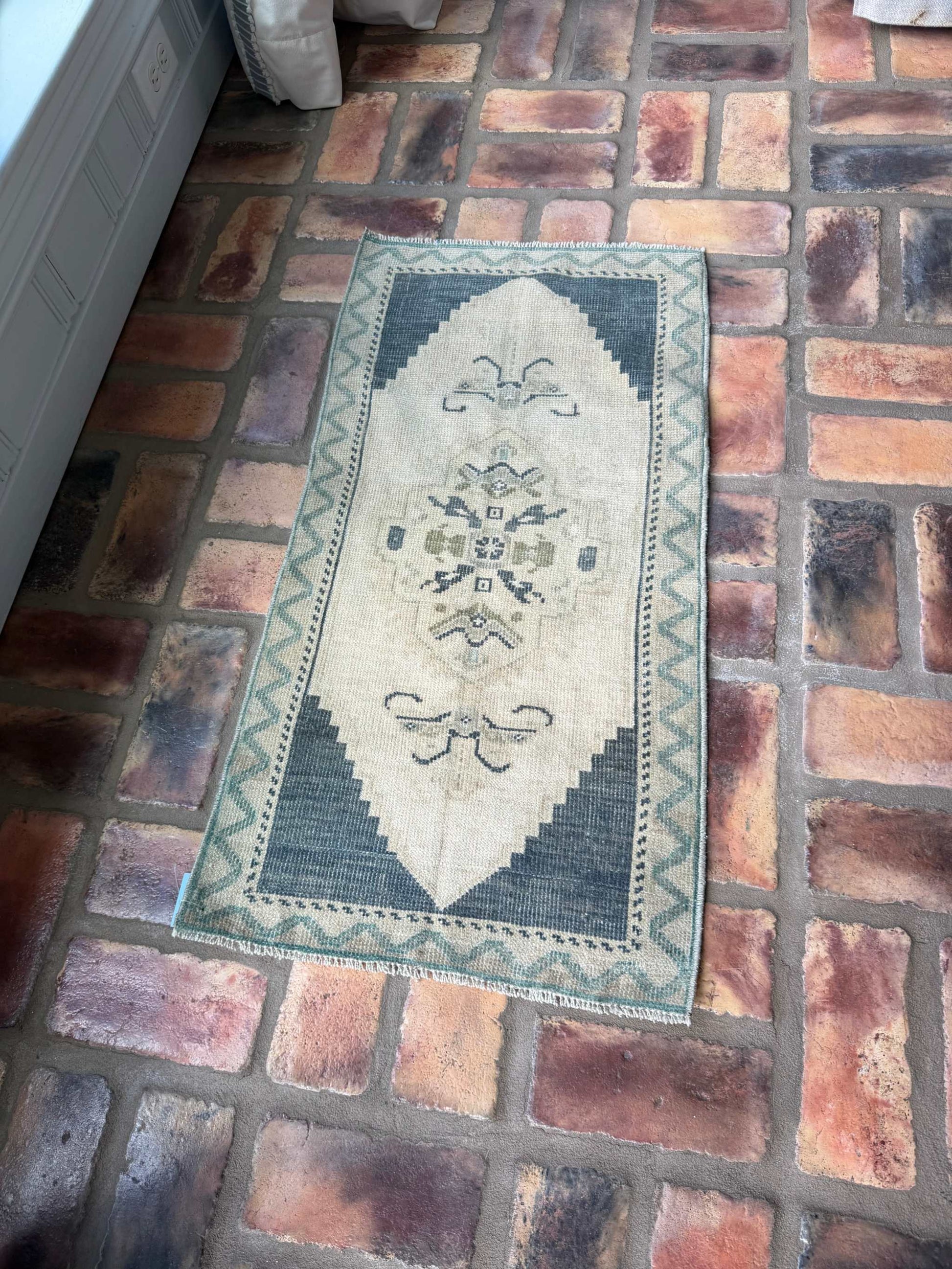 Small vintage hand-knotted wool rug in deep slate blue and beige, 1'6.5" x 3'