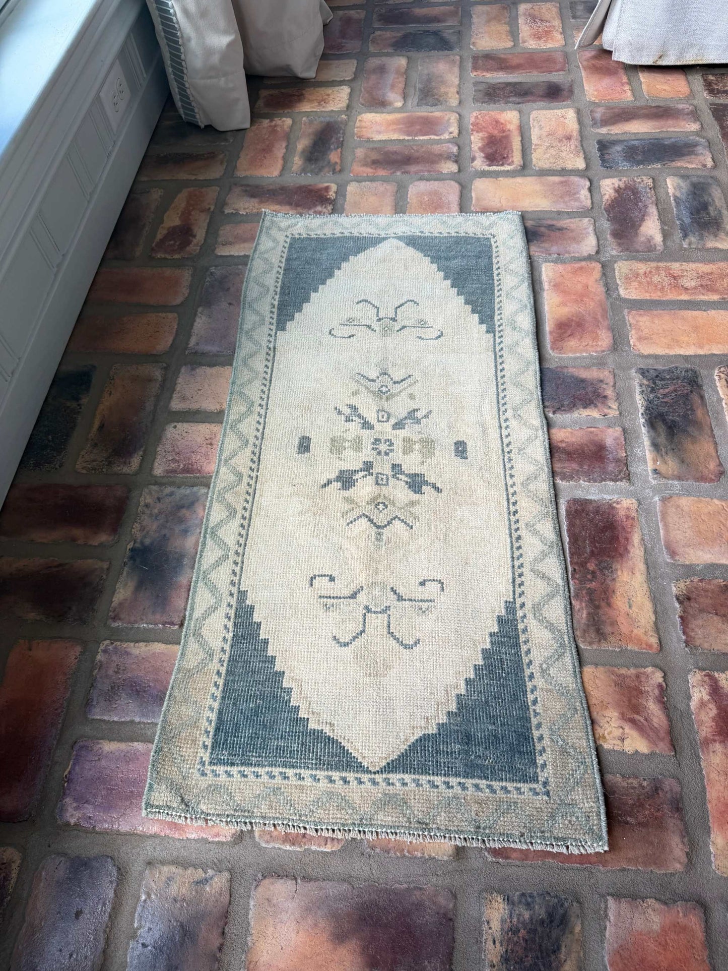 Small vintage hand-knotted wool rug with deep slate blue and beige tones
