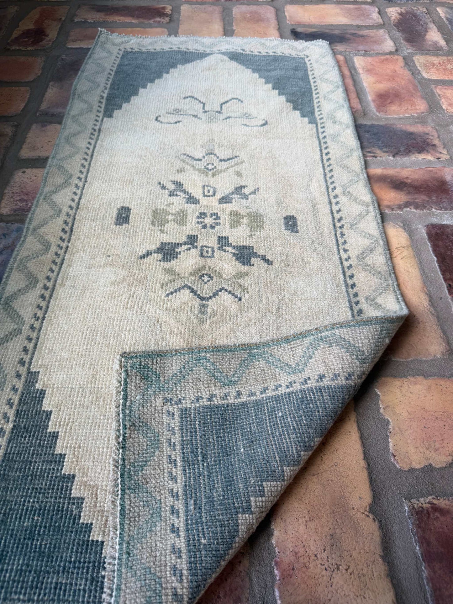 Small rug with deep slate blue and beige hand-knotted wool vintage design