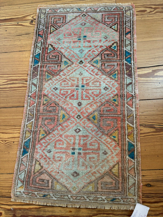 Colorful Turkish rug 1'8" x 3'1" with oranges, blues, and greens.