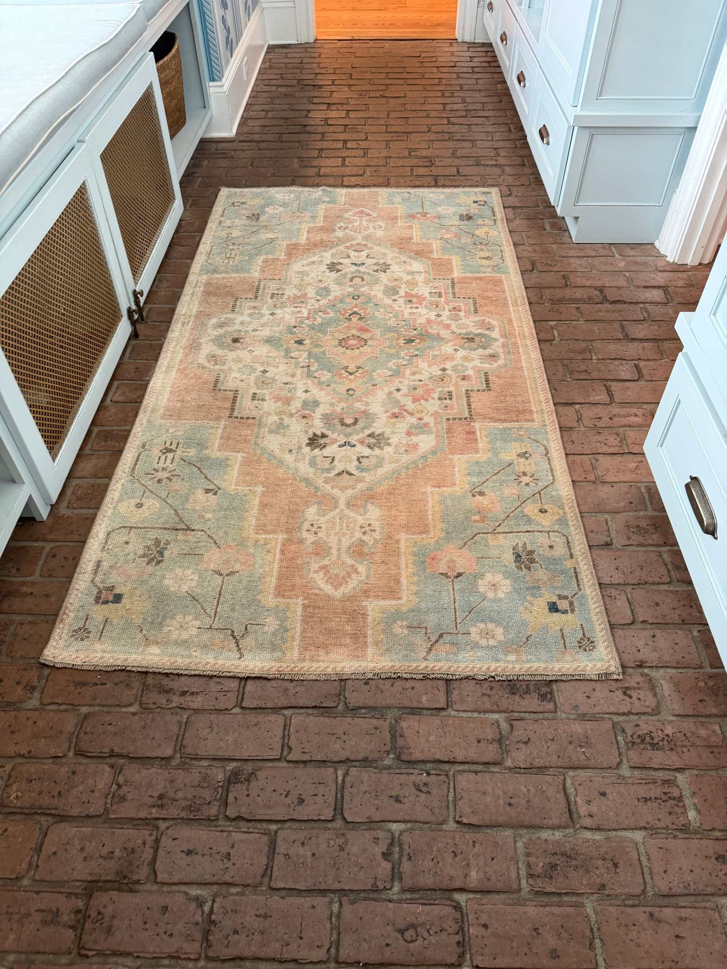 3'10" x 7'5" hand-knotted area rug with blue, rust, and gold details